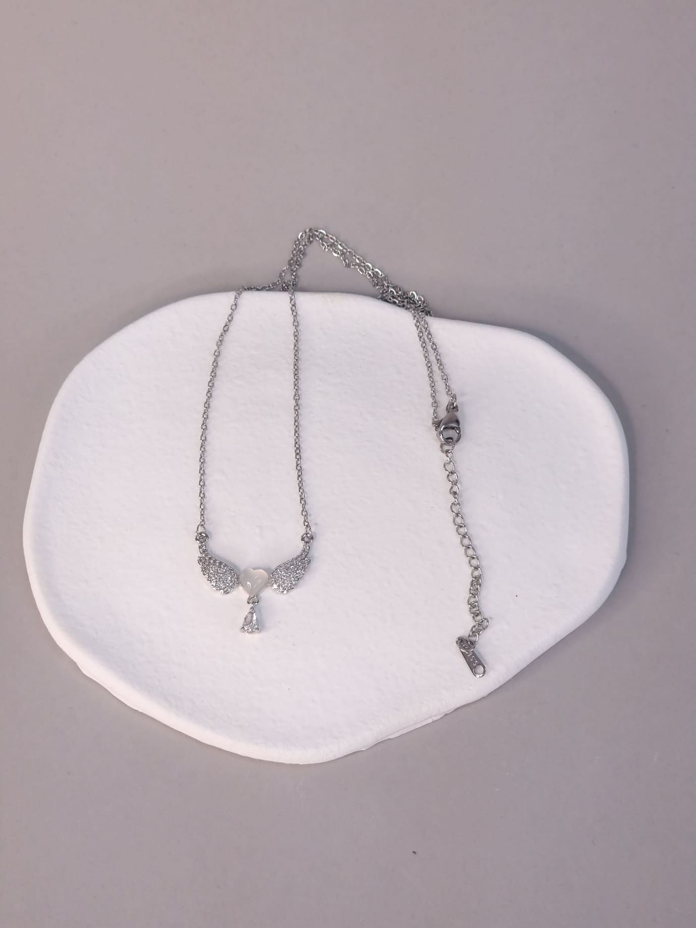 Κολιέ ατσάλι φτερά καρδιά-Ασημί Κολιέ ατσάλι φτερά καρδιά-Ασημί